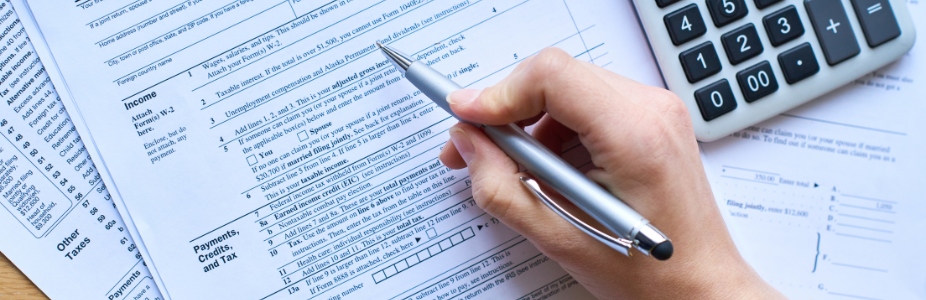 A person filling out the printable tax form